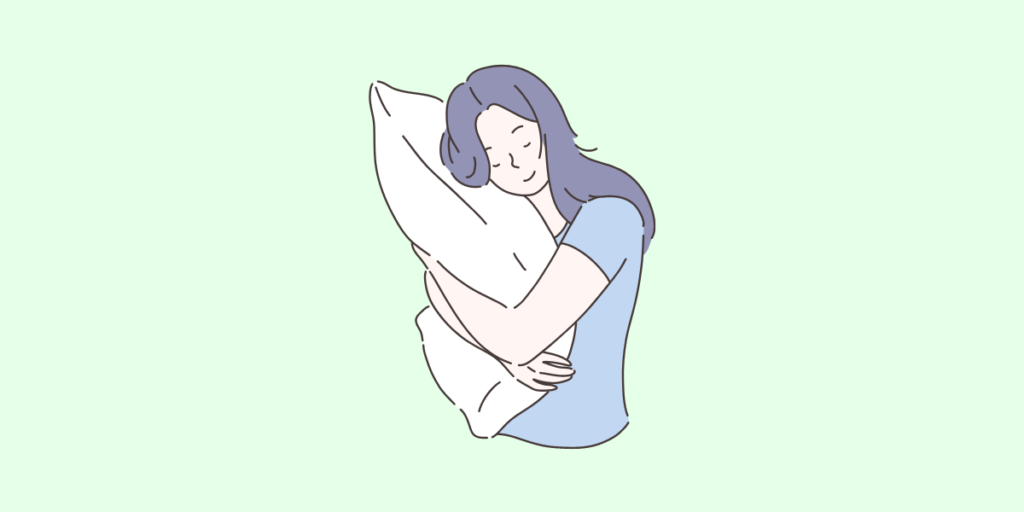 枕を抱える女性